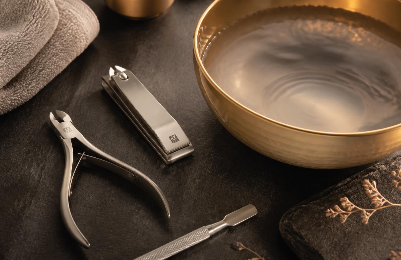 Premium men's grooming tools with a gold-rimmed bowl